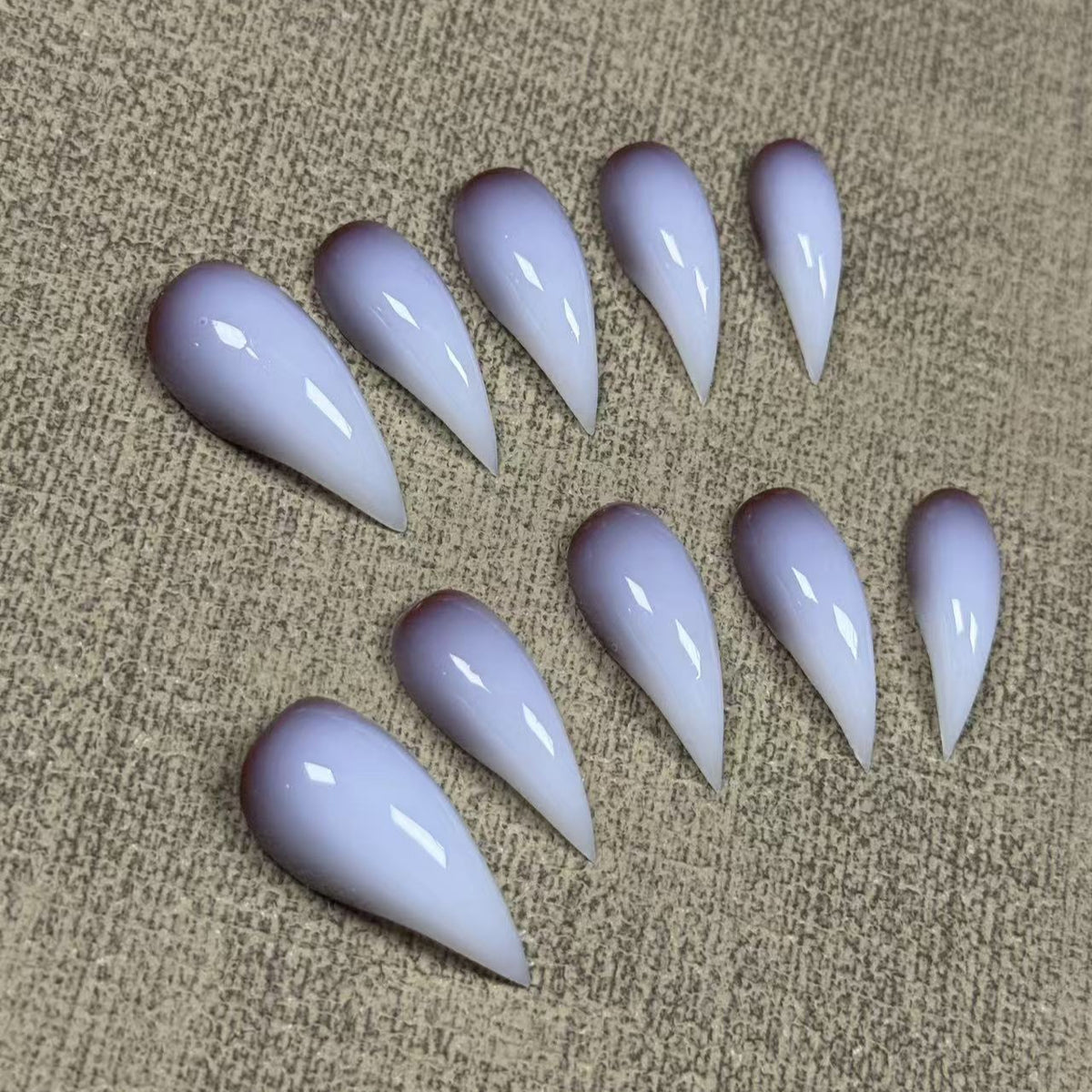 Pale white dragon claws