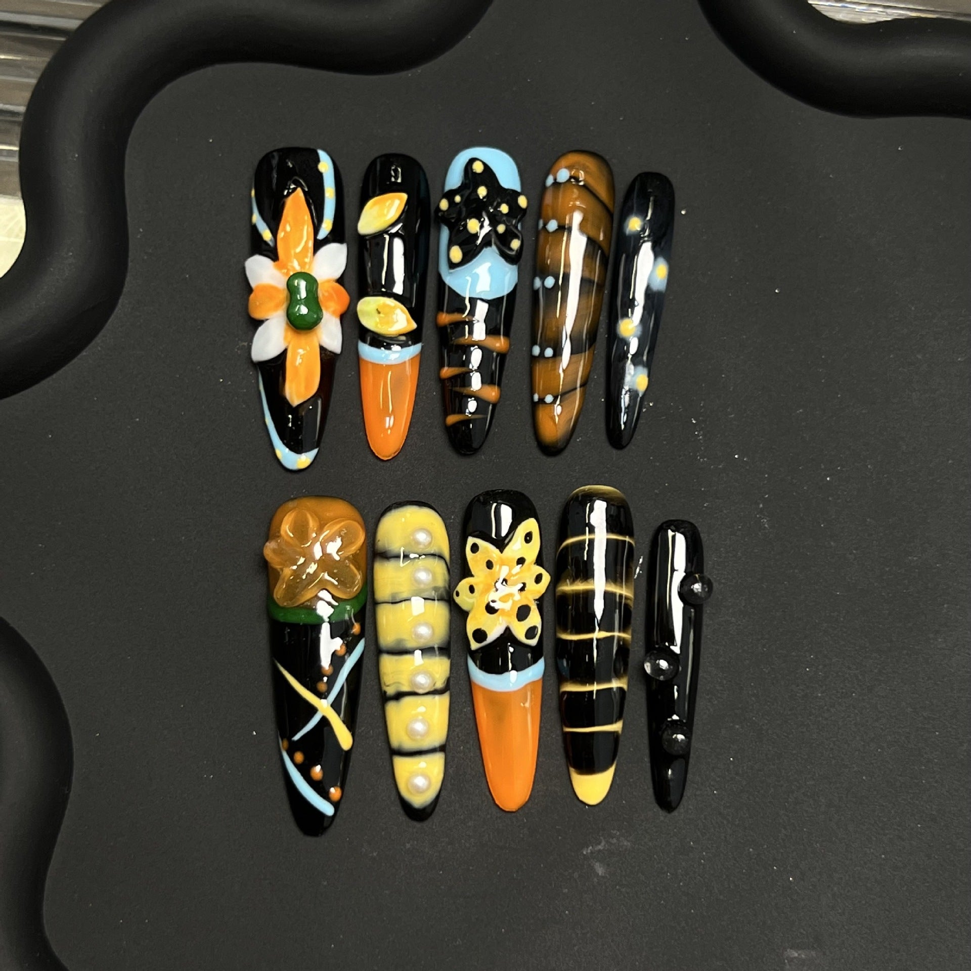 Hand carved three-dimensional fingernails